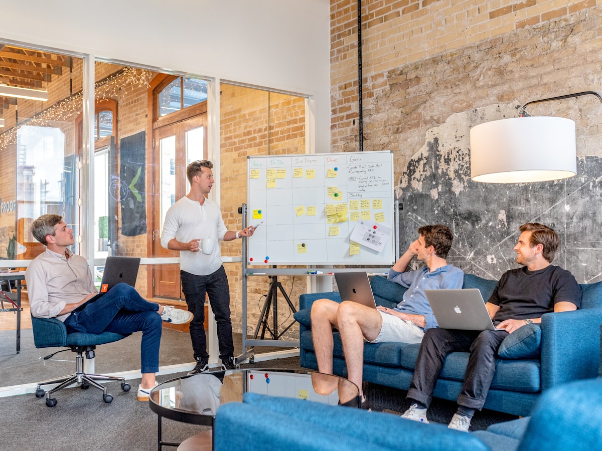 Summer Brand Campaign — team meeting in creative workspace